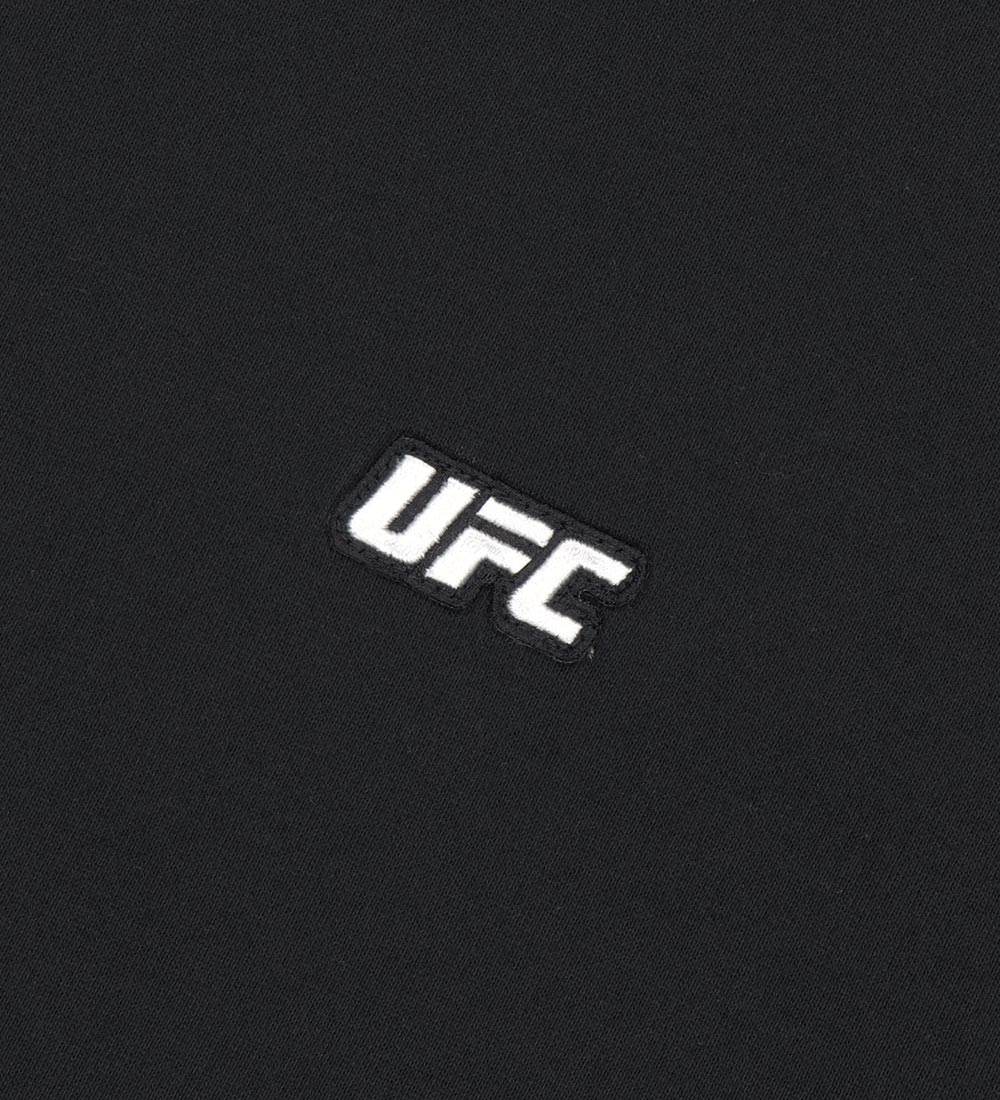 تيشيرت UFC أساسي بقصة فضفاضة، أسود